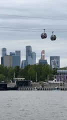 Cable cars operate over Moscow river amid city skyline