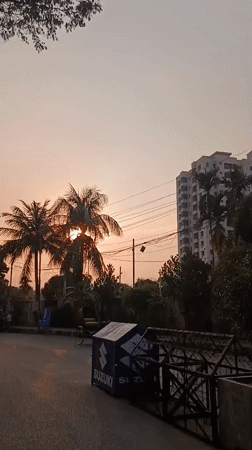 Evening street life documented across Dhaka during sunset hours