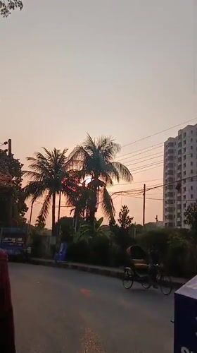 Evening street life documented across Dhaka during sunset hours