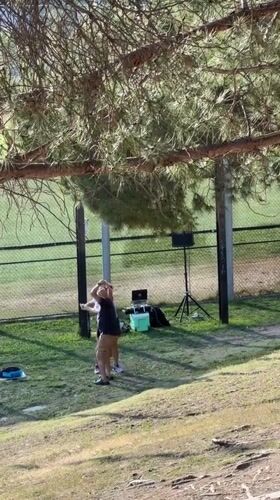 Couple dances in Los Angeles park near recreational area