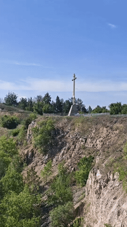 Memorial cross monument documented in Volzhskiy, Russia landscape views