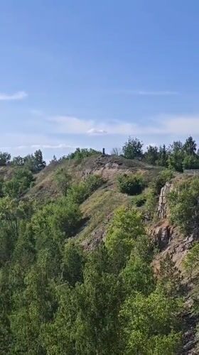 Memorial cross monument documented in Volzhskiy, Russia landscape views