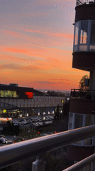 Evening meal enjoyed on Burgas balcony during urban sunset