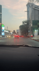 Evening traffic and sunset captured across Mexico City metro area