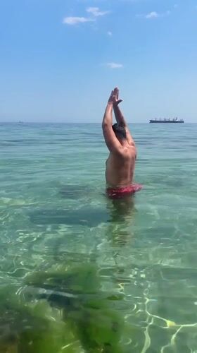 A lazy summer afternoon in the shallows at Varna's Black Sea beach.