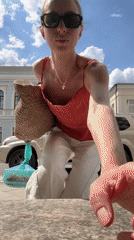 Woman with bags spotted on sidewalk during morning hours