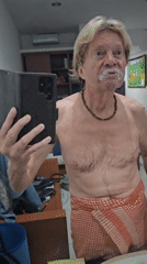 Man takes mirror selfie in Denpasar bathroom