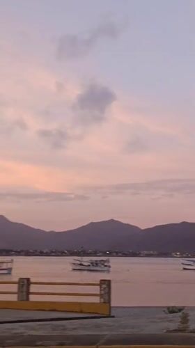 Dusk seascape with anchored boats filmed in Juan Griego
