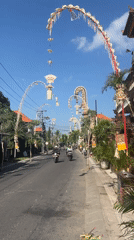 Ornate ceremonial structures line a street in Mengwi, Bali