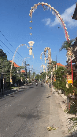 Ornate ceremonial structures line a street in Mengwi, Bali