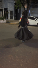 Woman spins in circles on Buenos Aires street