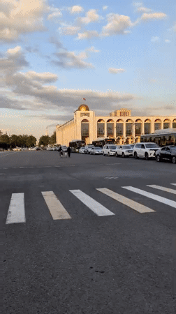 Bishkek's central square at golden hour, fountain and monument