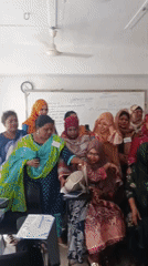 Morning in Dhaka: street traffic and a classroom session underway