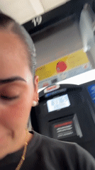 Woman refuels car at Costco gas station in Puebla