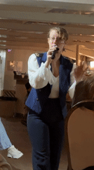 Woman performs for boat passengers in Saint Petersburg