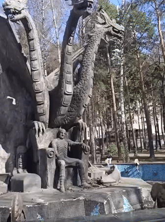 Dragon sculpture and cafe documented during Novosibirsk park visit