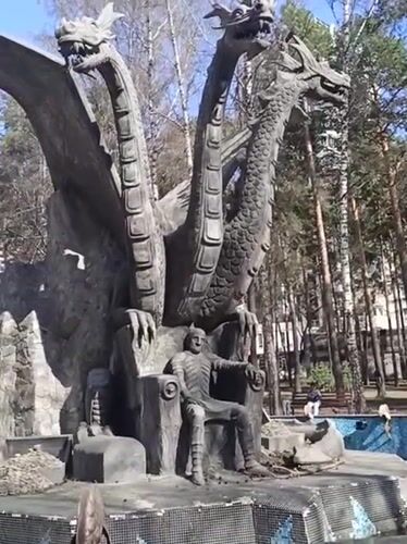 Dragon sculpture and cafe documented during Novosibirsk park visit