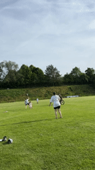 Families enjoy afternoon recreation in German countryside field