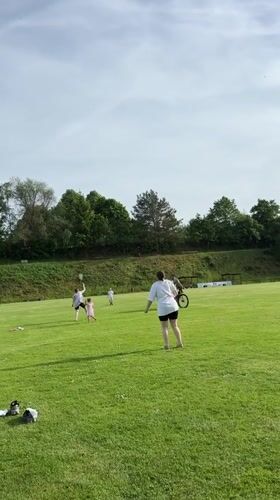 Families enjoy afternoon recreation in German countryside field