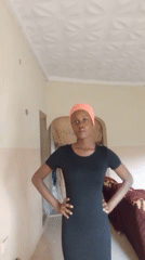 Woman poses for selfies, gestures indoors in Akwanga Nigeria
