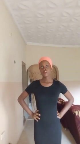 Woman poses for selfies, gestures indoors in Akwanga Nigeria