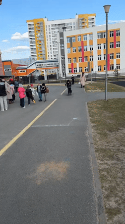 Boy plays with scooter at Tobolsk playground on sunny day