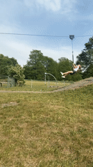 Girl plays at London park, rides zip line and cartwheels