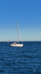 White sailboat spotted off Dénia coast under clear skies