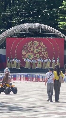 Traditional dancers perform at outdoor market in Stavropol park