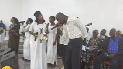 Church service with choirs and brass band in Goni Gara