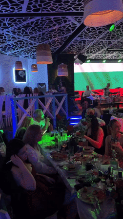 Live band performs with Bulgarian flag backdrop in Plovdiv venue