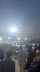 Evening crowd gathers in Al Falah Modern City parking area