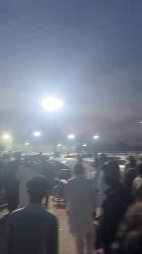 Evening crowd gathers in Al Falah Modern City parking area