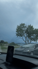 Driver records scenic lakeside journey near Tbilisi under cloudy skies