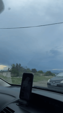 Driver records scenic lakeside journey near Tbilisi under cloudy skies