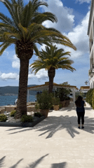 Tourists and locals enjoy sunny morning at Tivat waterfront