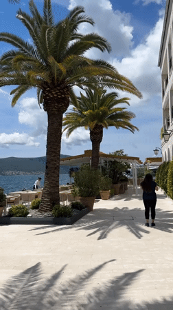 Tourists and locals enjoy sunny morning at Tivat waterfront