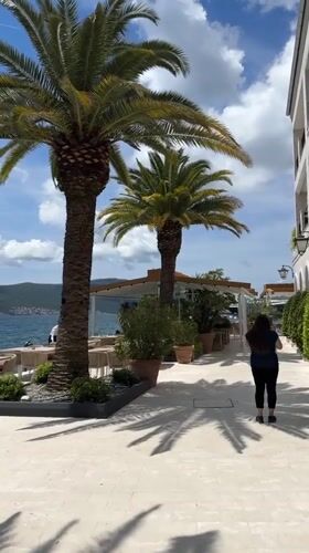 Tourists and locals enjoy sunny morning at Tivat waterfront