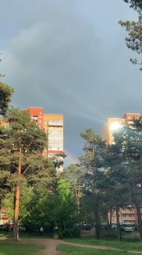 Rainbow appears over Dmitrov apartment buildings amid daily life