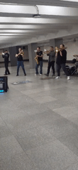 Brass band performs in underground venue