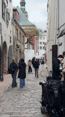 Film production activity observed on historic Riga cobblestone street