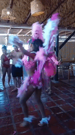 Colorful dance performance at beachside venue in Porlamar, Venezuela