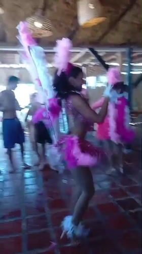 Colorful dance performance at beachside venue in Porlamar, Venezuela
