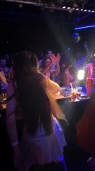 Woman dances at DJ console in Ban Tai Thailand
