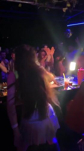 Woman dances at DJ console in Ban Tai Thailand
