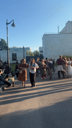 Afternoon park gathering features dancing, photos in Saint Petersburg
