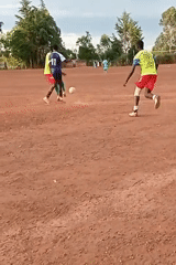 Soccer match played on dirt field in Kenya