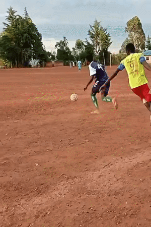 Soccer match played on dirt field in Kenya