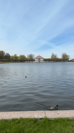 Spring morning visitors explore Peterhof Palace gardens in Russia