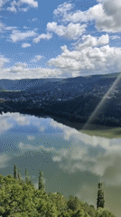 Pancharevo Lake from above, green hills and calm water